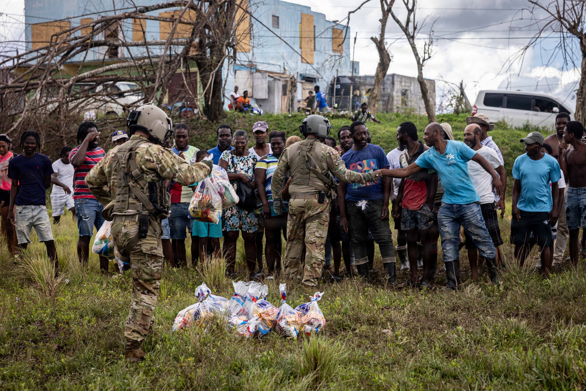 Military and civilian people greet each other