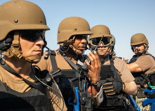 U.S. Sailors conduct a visit, board, search, and seizure training exercise on the flight deck of the Arleigh Burke-class guided-missile destroyer USS Mitscher (DDG 57). Mitscher is deployed to the U.S. 5th Fleet area of operations to support maritime security and stability in the U.S. Central Command area of responsibility.