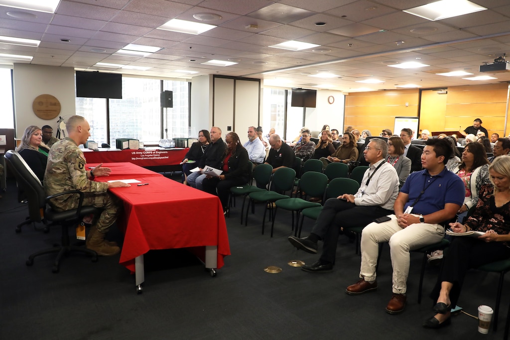 Col. Andrew Baker, Los Angeles District commander, second from left, delivers remarks during the End of Fiscal Year 2025 Town Hall and Awards Celebration Oct. 16 in downtown LA.