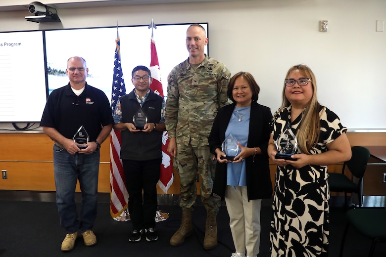 Col. Andrew Baker, Los Angeles District commander, center, joins awardees for photos Oct. 16 at the district headquarters in downtown LA.