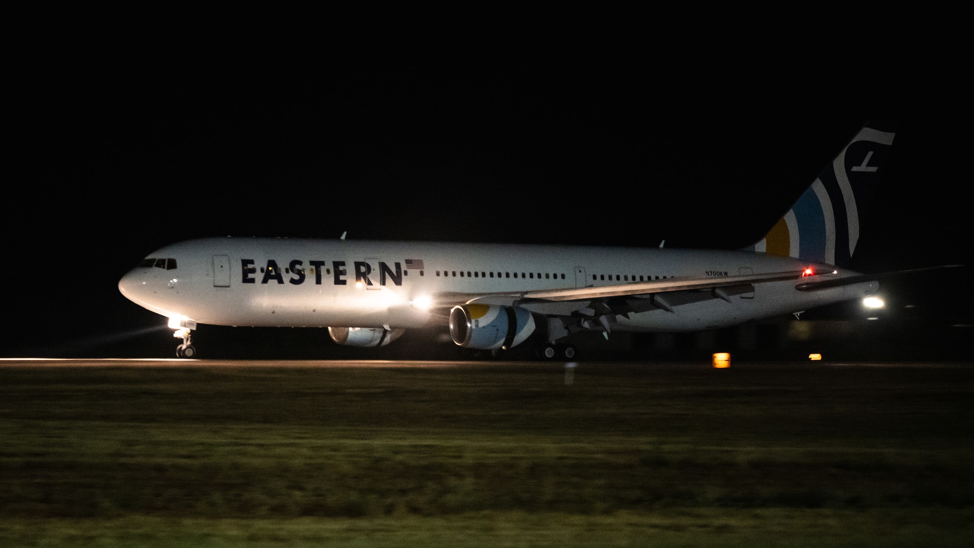 An Eastern Airlines Boeing 767-300 transporting U.S. Airmen from Barksdale Air Force Base, Louisiana, and Minot AFB, North Dakota, prepares to land at Dyess AFB, Texas, as part of Exercise Global Thunder 26, Oct. 25, 2025. Global Thunder is an annual command and control exercise designed to train U.S. Strategic Command Forces and assess joint operational readiness. (U.S. Air Force photo by Senior Airman Jade M. Caldwell)