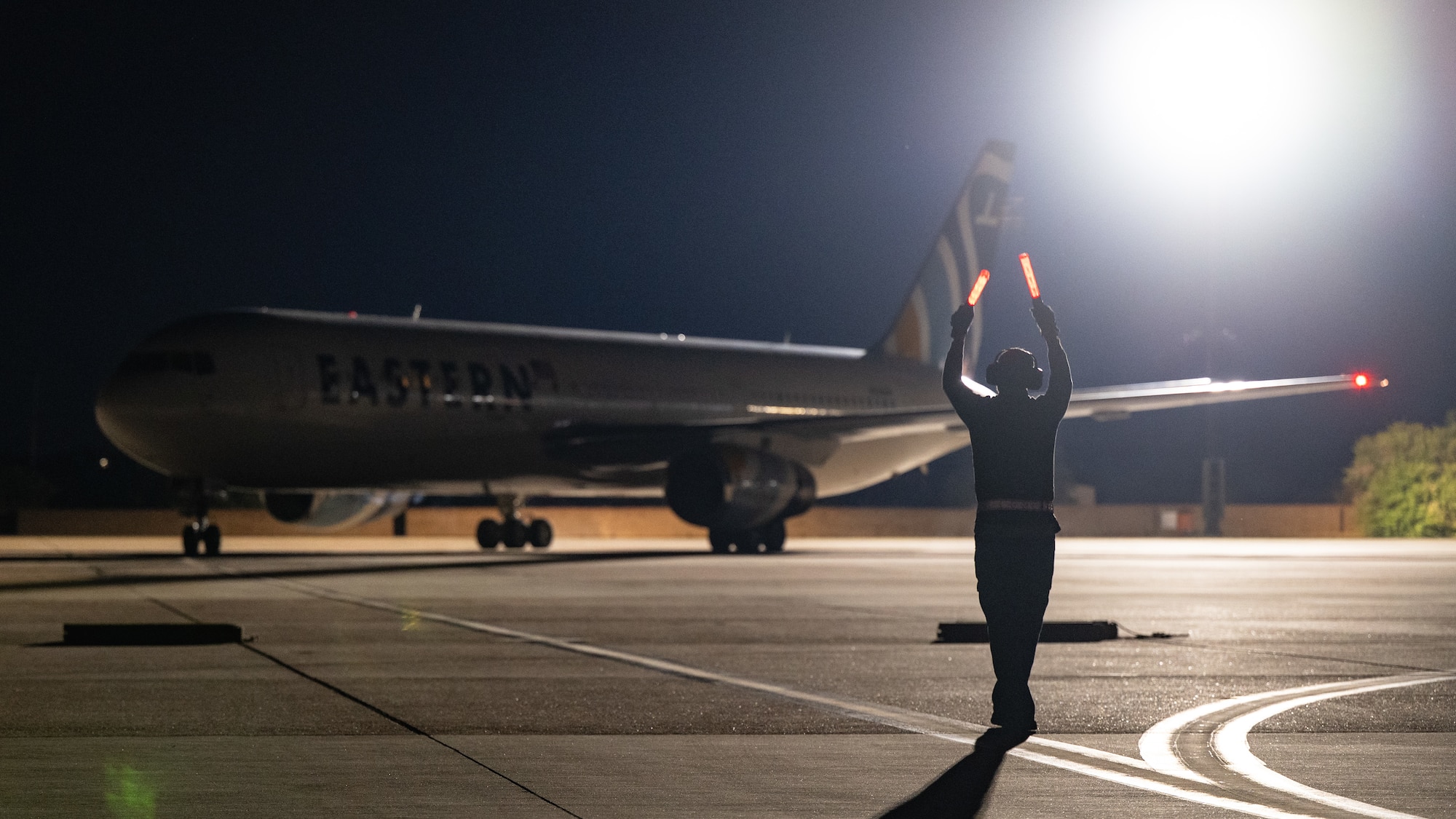 An Eastern Airlines Boeing 767-300 transporting U.S. Airmen from Barksdale Air Force Base, Louisiana, and Minot AFB, North Dakota, taxis to park as part of Exercise Global Thunder 26 at Dyess AFB, Texas, Oct. 25, 2025. Global Thunder is an annual command and control exercise designed to train U.S. Strategic Command Forces and assess joint operational readiness. (U.S. Air Force photo by Senior Airman Jade M. Caldwell)