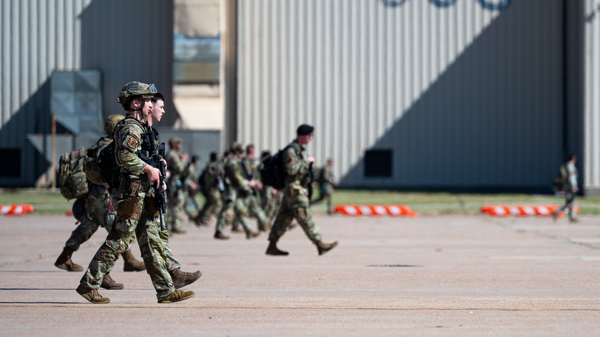 U.S. Airmen stationed at Minot Air Force Base, North Dakota, and Barksdale AFB, Louisiana, inspect a secured area as part of Exercise Global Thunder 26 at Dyess AFB, Texas, Oct. 26, 2025. Global Thunder is an annual command and control exercise designed to train U.S. Strategic Command Forces and assess joint operational readiness. (U.S. Air Force photo by Senior Airman Jade M. Caldwell)