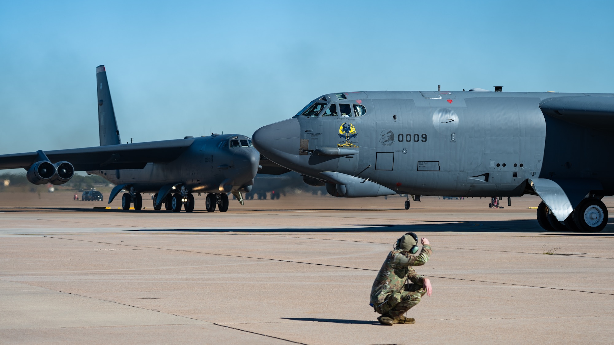 Two U.S. Air Force B-52 Stratofortress, stationed at Minot Air Force Base, North Dakota, taxi prior to departure as part of Exercise Global Thunder 26 at Dyess AFB, Texas, Oct. 29, 2025. Global Thunder is an annual command and control exercise designed to train U.S. Strategic Command Forces and assess joint operational readiness. (U.S. Air Force photo by Senior Airman Jade M. Caldwell)