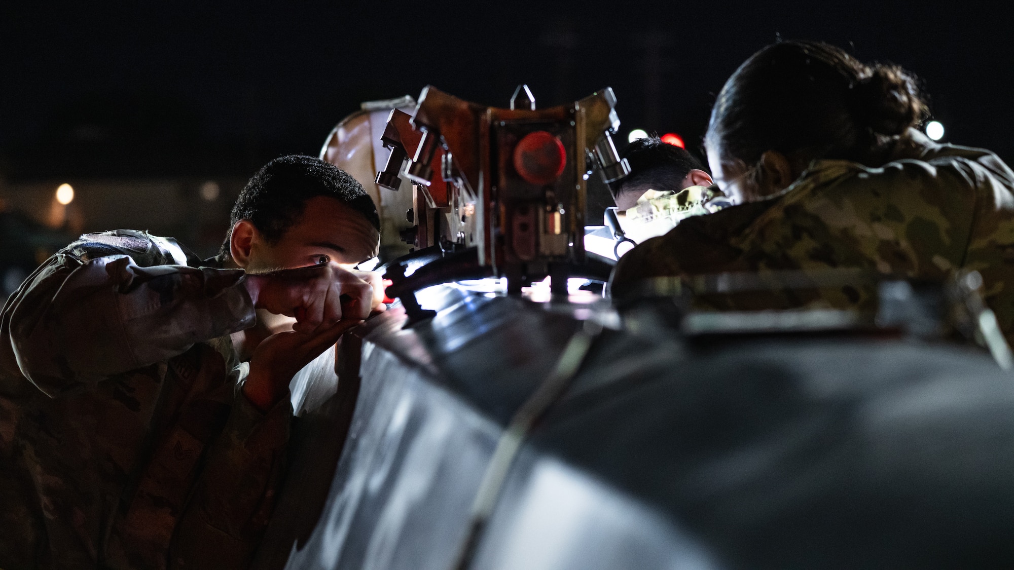 U.S. Airmen assigned to Air Force Global Strike Command, prepare a training munition for load as part of Exercise Global Thunder 26 at Dyess Air Force Base, Texas, Oct. 28, 2025. Global Thunder is an annual command and control exercise designed to train U.S. Strategic Command Forces and assess joint operational readiness. (U.S. Air Force photo by Senior Airman Jade M. Caldwell)