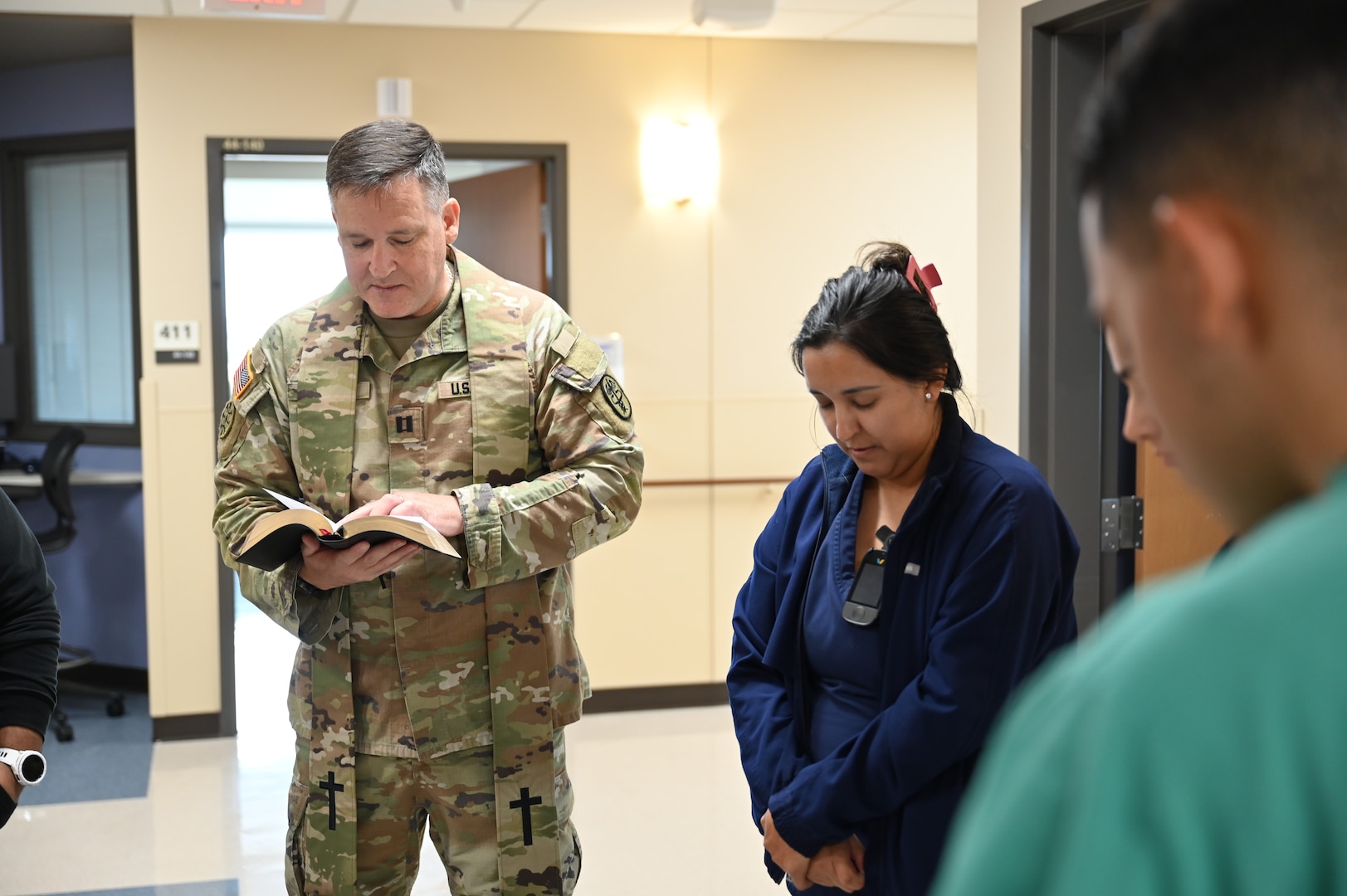 Chaplain (Capt.) Steven Troupe leads a prayer during the Blessing of the Hands ceremony at Carl R. Darnall Army Medical Center, Fort Hood, Texas. The gathering allowed staff to receive a blessing while joining in a shared moment of reflection and renewal.