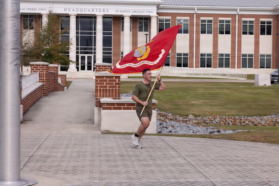 U.S. Marines with MWHS-2 completed the final mile of a 250-mile relay run with a formation run in celebration of the Marine Corps' 250th birthday. (U.S. Marine Corps photo by Cpl. Anakin Smith)