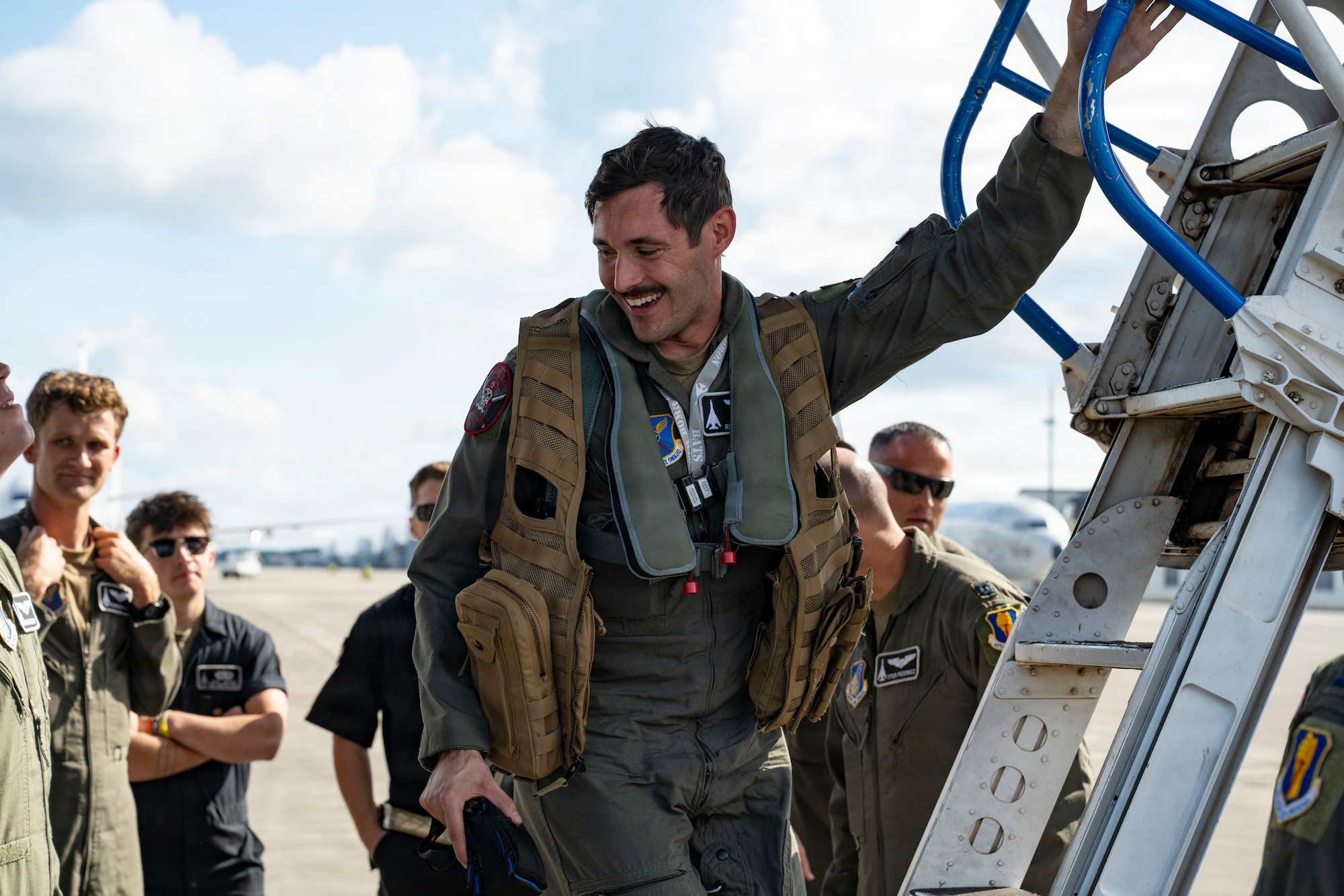 A maintainer works outside on a plane
