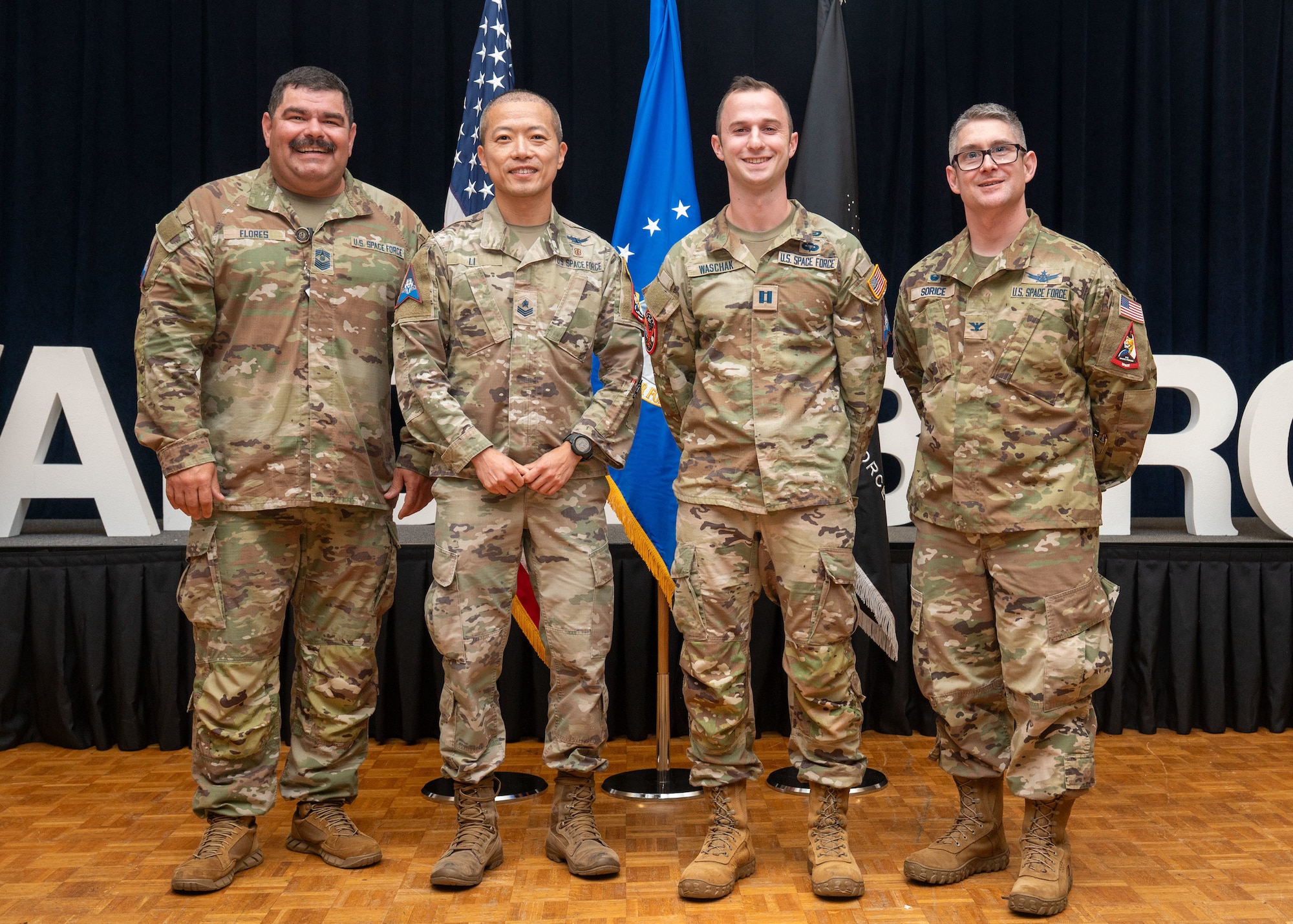 Selected Team Vandenberg 2025 Guardian Arena competitors from Space Delta 5 stand and smile for a photo.