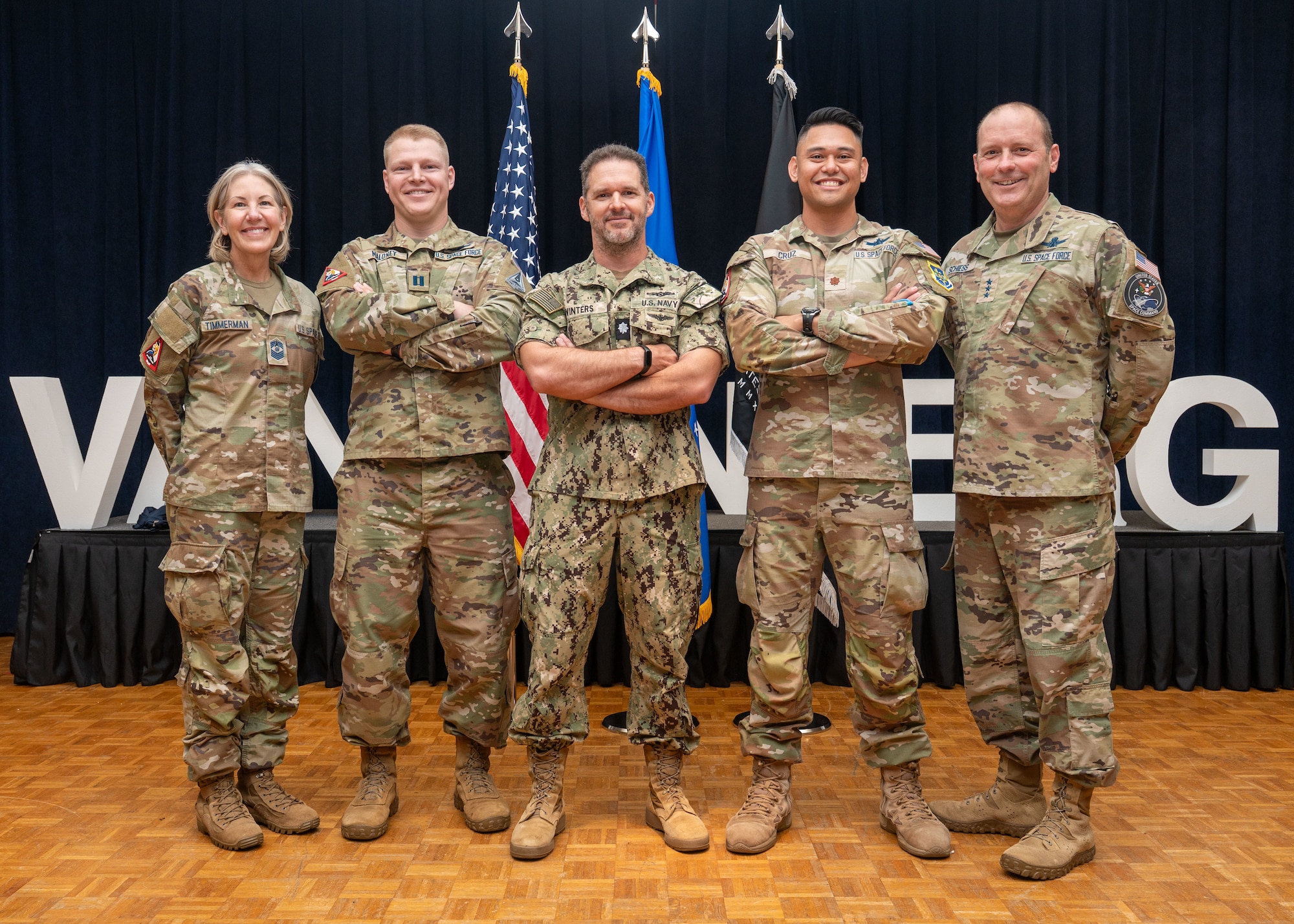 U.S. Space Force Lt. Gen. Douglas Schiess, U.S. Space Forces – Space commander and United States Space Command’s Combined Joint Force Space Component commander, right, and U.S. Space Force Chief Master Sgt. Tina Timmerman, S4S senior enlisted leader, left, stand alongside selected Team Vandenberg 2025 Guardian Arena competitors from U.S. Space Forces – Space, a Vandenberg Space Force Base mission partner.