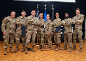 U.S. Space Force Col. James Horne III, Space Launch Delta 30 commander, left, and U.S. Space Force Chief Master Sgt. Shannan Sanchez, SLD 30 senior enlisted leader, center, stand with Team Vandenberg personnel.