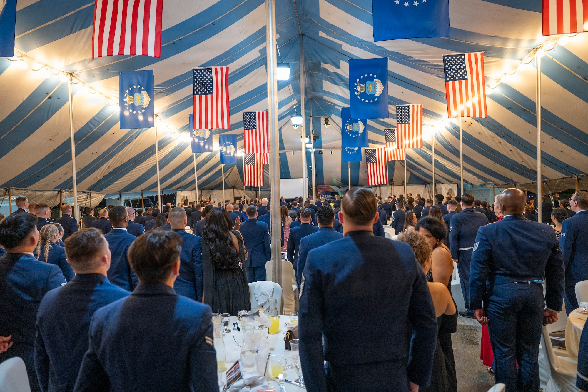 Attendees stand at attention as the colors are posted during the 2025 Air Force Ball in Seoul, Republic of Korea, Oct. 10, 2025.