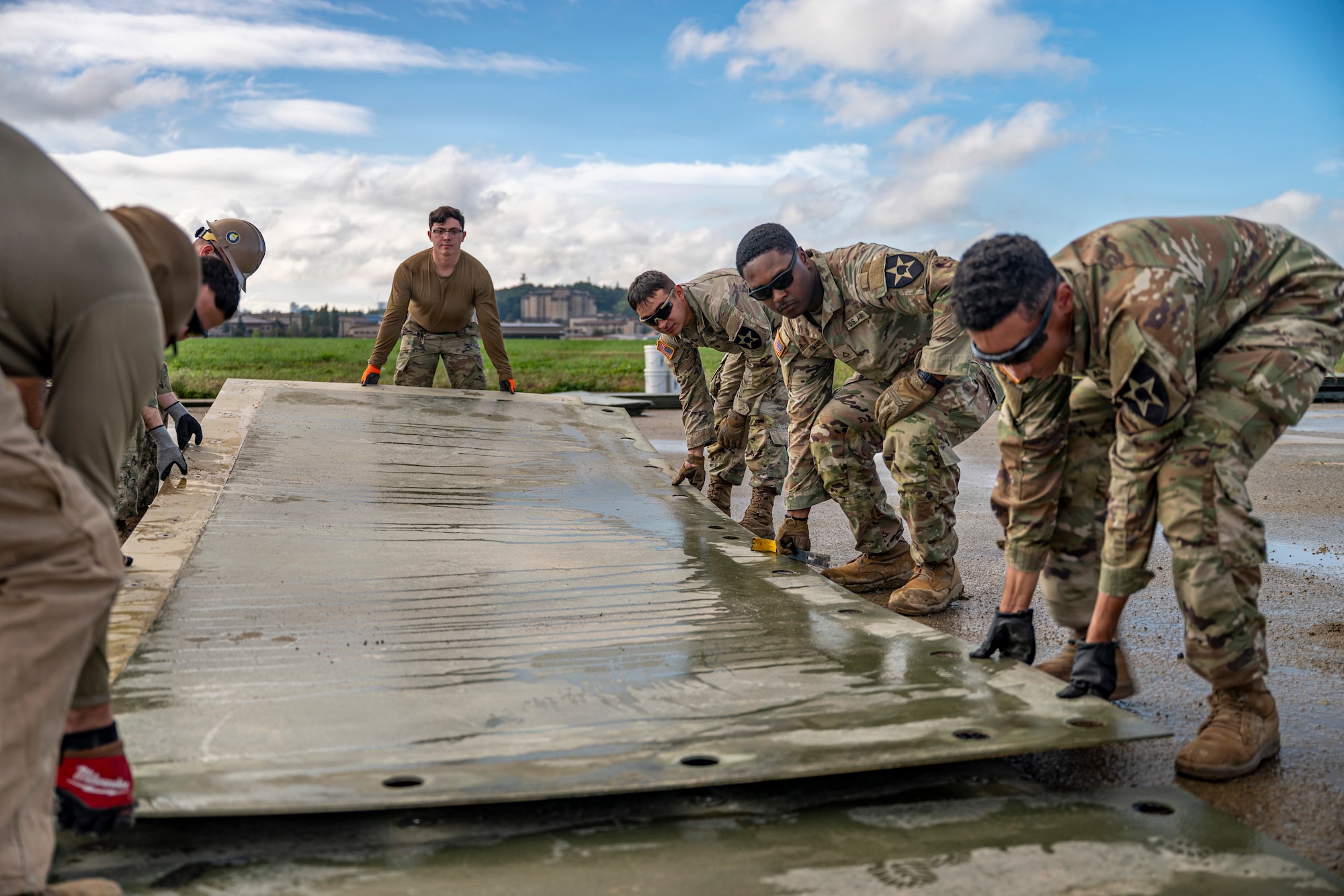Members of the U.S. Air Force, Army and Navy conduct a joint rapid airfield damage repair training at Osan Air Base, Republic of Korea, Oct.16, 2025.