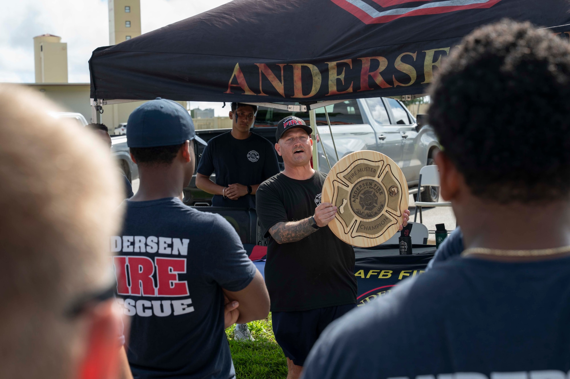 U.S. Air Force Master Sgt. Justin Miller, assistant chief of fire prevention for the 36th Civil Engineer Squadron Fire Department explains prizes for the top performing teams before the 2025 Fire Prevention Week muster at Andersen Air Force Base, Guam, Oct. 9, 2025.