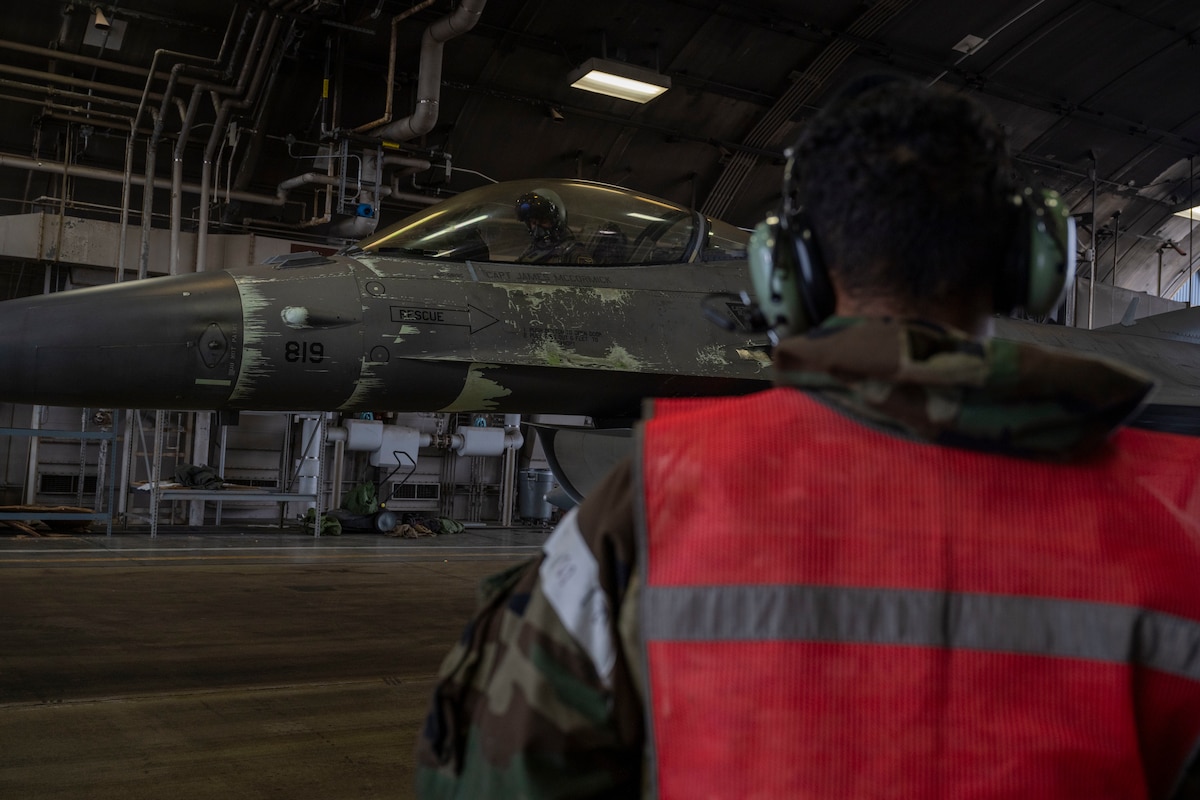 U.S. Air Force Staff Sgt. Pedro Muriel, 4th Fighter Generation Squadron crew chief, oversees a hot pit refuel during Beverly Sunrise 26-01 at Misawa Air Base, Japan, Oct. 16, 2025. Sustaining proficiency in hot pit refueling preserves the wing’s rapid response capability, ensuring aircraft remain mission-ready to support deterrence and stability throughout the theater. (U.S. Air Force photo by Senior Airman Patrick Boyle)