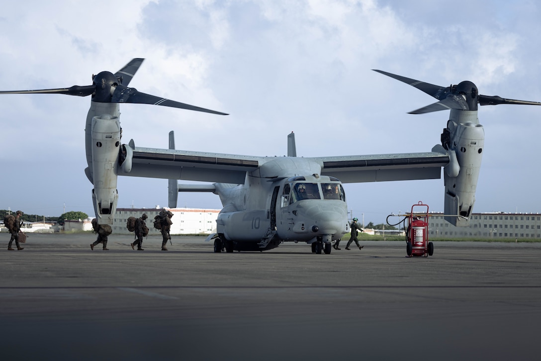 U.S. Marines with Battalion Landing Team 1st Battalion, 7th Marine Regiment, 31st Marine Expeditionary Unit, load onto a U.S. Marine Corps MV-22B Osprey assigned to Marine Medium Tiltrotor Squadron (VMM) 265 (Rein.), 31st MEU, during flight operations at Marine Corps Air Station Futenma, Okinawa, Japan, Sept. 26, 2025. The Marines conducted flight operations demonstrating multi-domain transport capabilities to support combined-joint all domain operations. The 31st MEU, the Marine Corps’ only continuously forward-deployed MEU, provides a flexible and lethal force, ready to perform a wide range of military operations as the premiere crisis response force in the Indo-Pacific region. (U.S. Marine Corps photo by Sgt. Angel Diaz Montes De Oca)