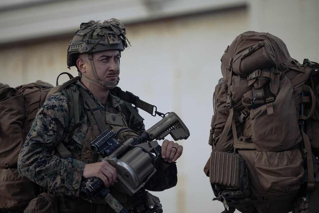 U.S. Marine Corps Lance Cpl. Zane Guffey, a rifleman with Battalion Landing Team 1st Battalion, 7th Marine Regiment, 31st Marine Expeditionary Unit, prepares to load onto a U.S. Marine Corps MV-22B Osprey assigned to Marine Medium Tiltrotor Squadron (VMM) 265 (Rein.), 31st MEU, during flight operations at Marine Corps Air Station Futenma, Okinawa, Japan, Sept. 26, 2025. The Marines conducted flight operations demonstrating multi-domain transport capabilities to support combined-joint all domain operations. The 31st MEU, the Marine Corps’ only continuously forward-deployed MEU, provides a flexible and lethal force, ready to perform a wide range of military operations as the premiere crisis response force in the Indo-Pacific region. (U.S. Marine Corps photo by Sgt. Angel Diaz Montes De Oca)