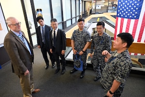 Vince Ross, meets with Japanese Air Self Defense Force delegates here, Sept. 29, 2025. The delegates traveled to Hanscom Air Force Base to learn about the Department of the Air Force’s Program Executive Office for Command, Control, Communications and Battle Management’s divisions and how they connect into the DAF BATTLE NETWORK. Ross is the Aerial Networks Division’s deputy. (Official Air Force Photo by Richard Blumenstein)