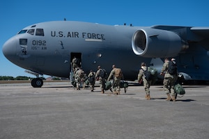 Airmen of the 102nd Intelligence Wing board a C-17 Globemaster III during Exercise Formosa Guardian on Otis Air National Guard Base, Massachusetts, Aug. 22, 2025.
