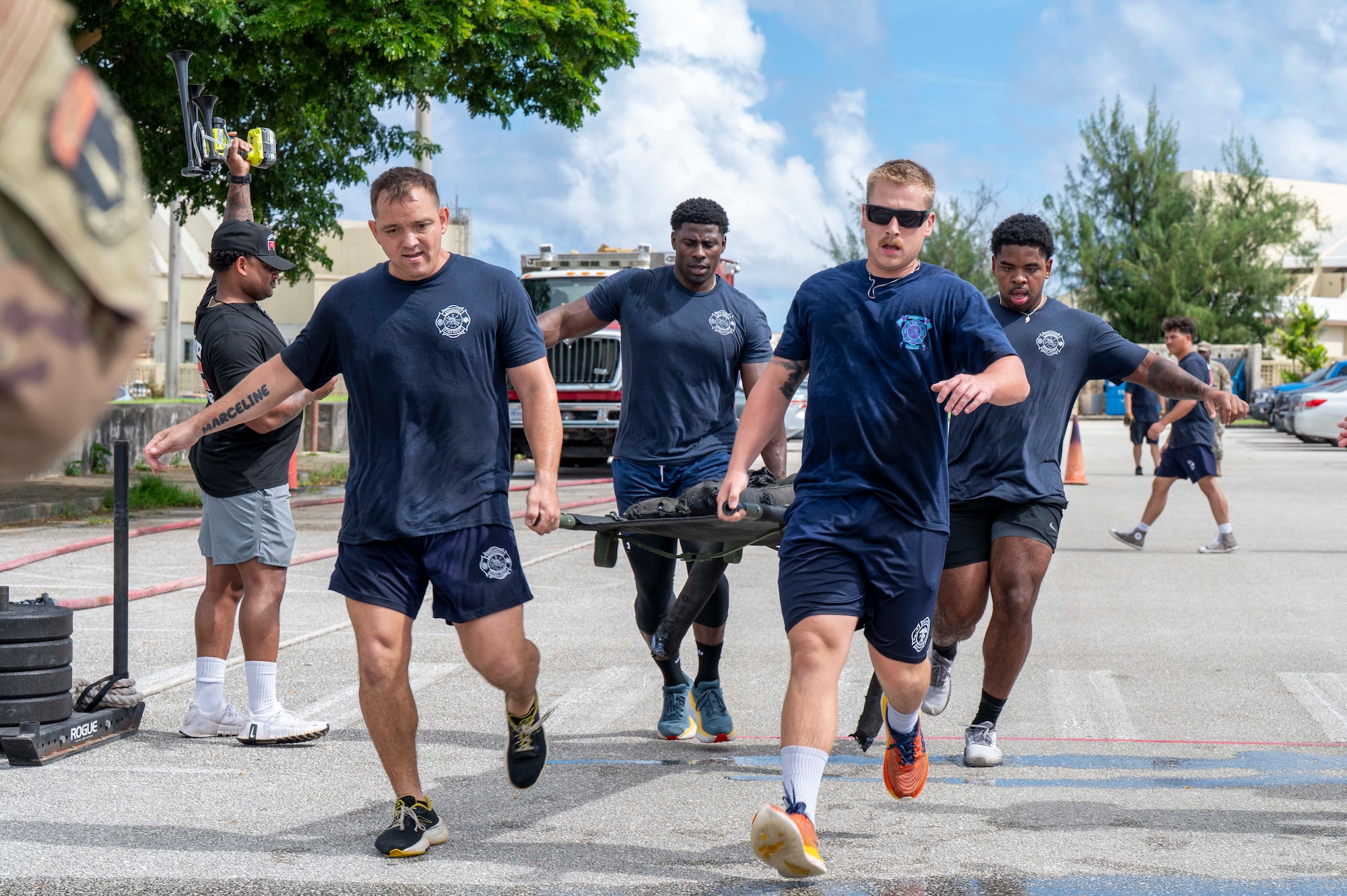 Members of the 36th Civil Engineer Squadron Fire Department complete an obstacle course during the 2025 Fire Prevention Week muster at Andersen Air Force Base, Guam, Oct. 9, 2025.