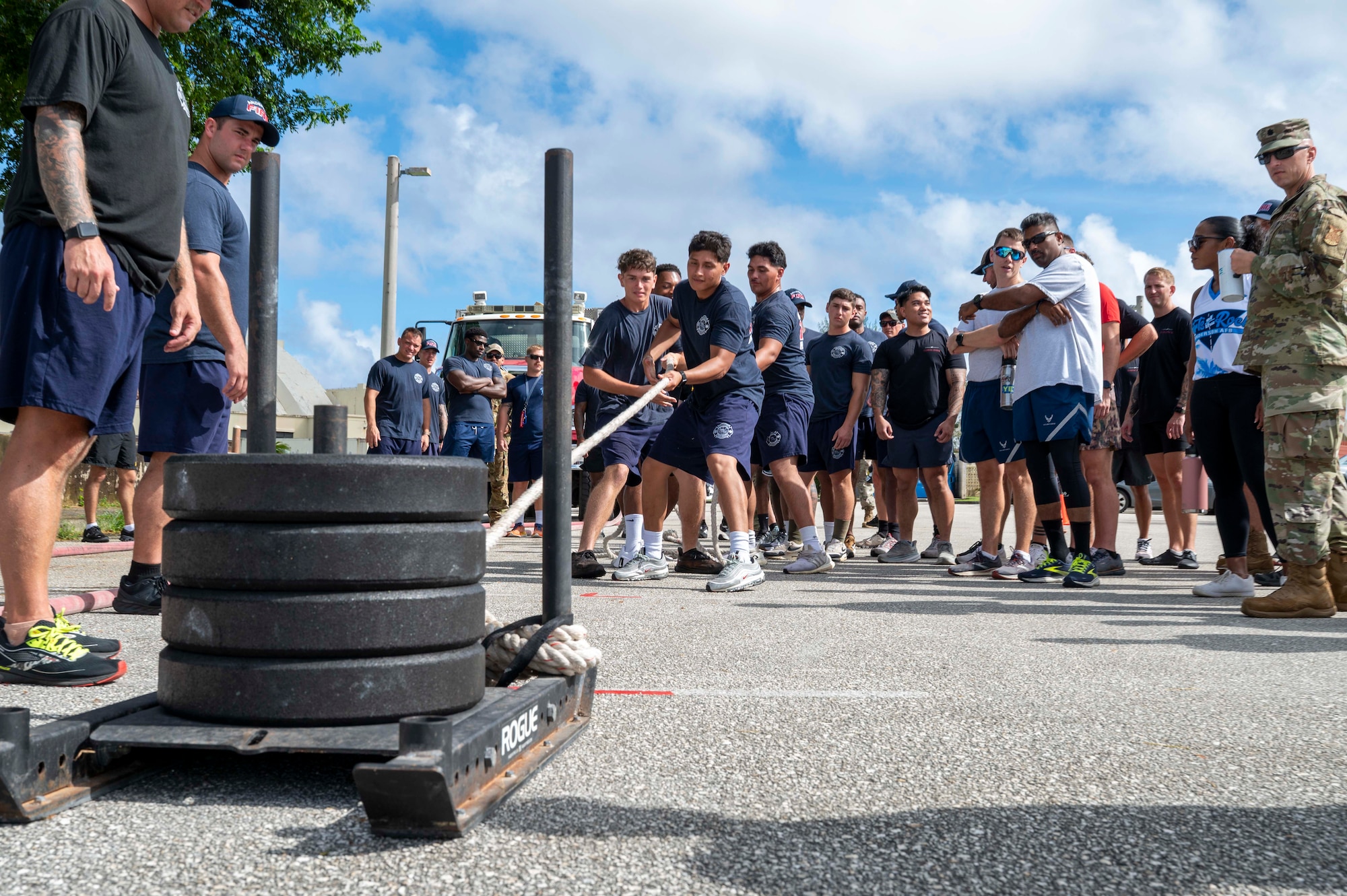 Members of the 36th Civil Engineer Squadron Fire Department pull a weighted sled during 2025 Fire Prevention Week muster at Andersen Air Force Base, Guam, Oct. 9, 2025.