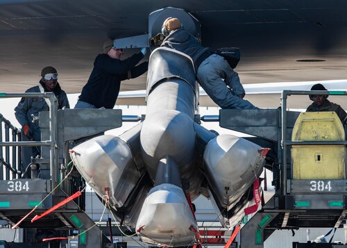 U.S. Airmen assigned to the 5th Maintenance Group, Minot Air Force Base, North Dakota, load AGM-86 air-launched cruise missiles onto a B-52H Stratofortress assigned to the 5th Bomb Wing during Global Thunder 26 at Minot Air Force Base, North Dakota, Oct. 22, 2025. Exercises continually develop Airmen and aircrew skill sets by improving operational capabilities and increasing mission readiness.