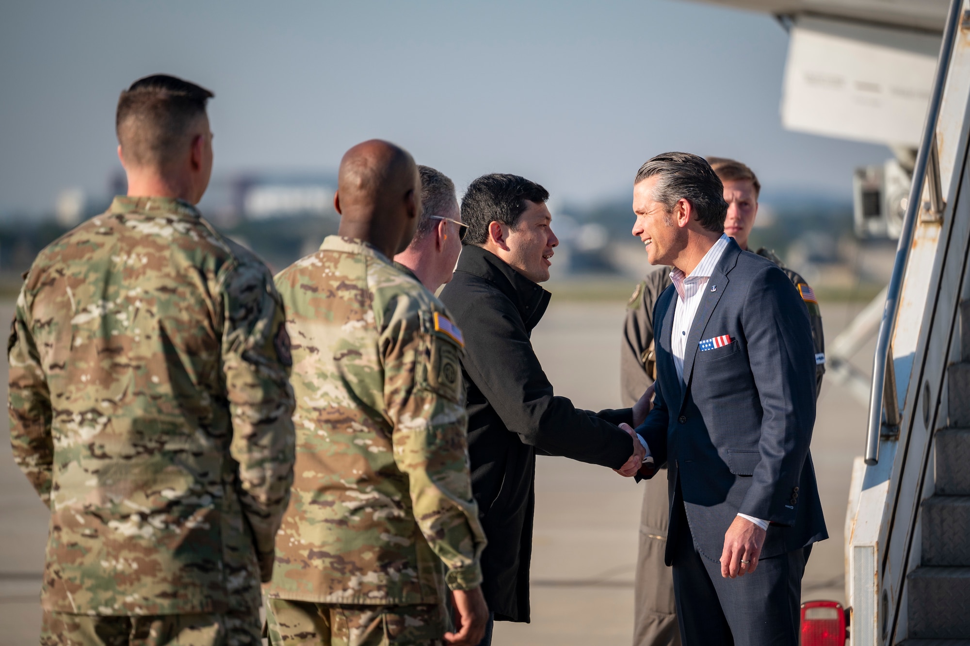Secretary of War Pete Hegseth is greeted by Kevin Kim, acting U.S. Ambassador to the Republic of Korea at Osan Air Base, ROK, Nov. 3, 2025.