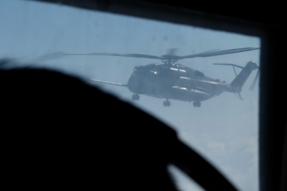 A U.S. Marine Corps CH-53E Super Stallion assigned to Marine Medium Tiltrotor Squadron (VMM) 265 (Rein), 31st Marine Expeditionary Unit, prepares to conduct mid-air refueling during flight operations in the Philippine Sea, Sep. 26, 2025. The Marines conducted flight operations demonstrating multi-domain transport capabilities to support combined-joint all domain operations. The 31st MEU, the Marine Corps’ only continuously forward deployed MEU, provides a flexible and lethal force, ready to perform a wide range of military operations as the premiere crisis response force in the Indo-Pacific region. (U.S. Marine Corps photo by Lance Cpl. Gerardo Mendez)