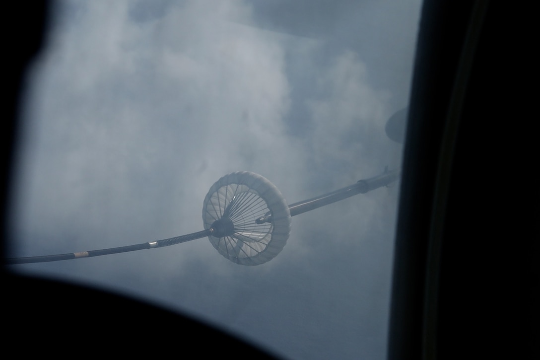 A U.S. Marine Corps CH-53E Super Stallion assigned to Marine Medium Tiltrotor Squadron (VMM) 265 (Rein), 31st Marine Expeditionary Unit, prepares to conduct mid-air refueling during flight operations in the Philippine Sea, Sep. 26, 2025. The Marines conducted flight operations demonstrating multi-domain transport capabilities to support combined-joint all domain operations. The 31st MEU, the Marine Corps’ only continuously forward deployed MEU, provides a flexible and lethal force, ready to perform a wide range of military operations as the premiere crisis response force in the Indo-Pacific region. (U.S. Marine Corps photo by Lance Cpl. Gerardo Mendez)