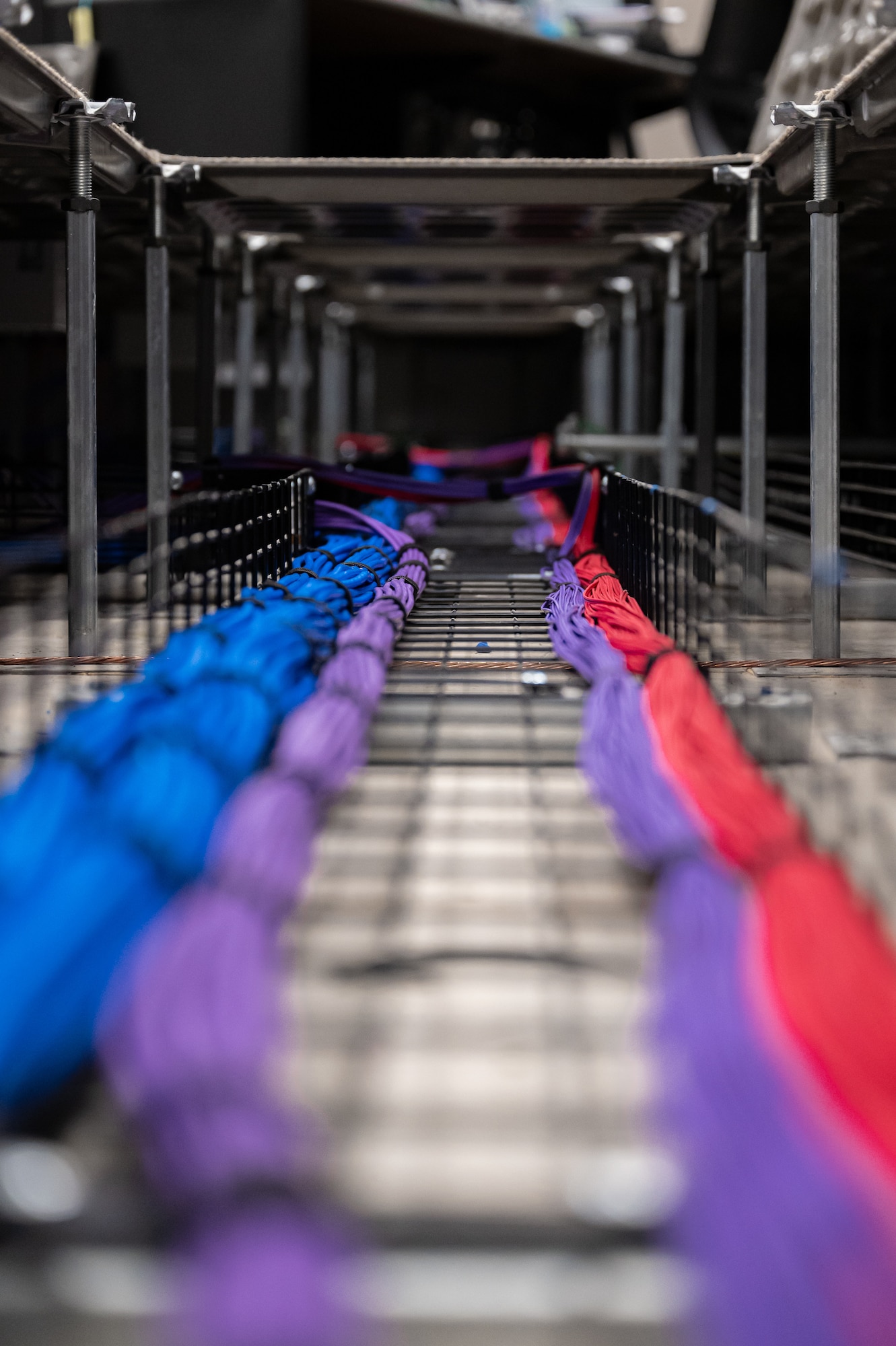 Fiber-optic cables run under a floor of the 36th Wing Installation Control Center at Andersen Air Force Base, Guam, Sept. 17, 2025.