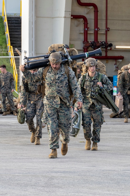 U.S. Marines with Battalion Landing Team 1st Battalion, 7th Marine Regiment, 31st Marine Expeditionary Unit, transport gear during flight operations at Marine Corps Air Station Futenma, Okinawa, Japan, Sept. 26, 2025. The Marines conducted flight operations demonstrating multi-domain transport capabilities of the 31st MEU. The 31st MEU, the Marine Corps’ only continuously forward-deployed MEU, provides a flexible and lethal force, ready to perform a wide range of military operations as the premiere crisis response force in the Indo-Pacific region. (U.S. Marine Corps photo by Lance Cpl. Skilah Sanchez)