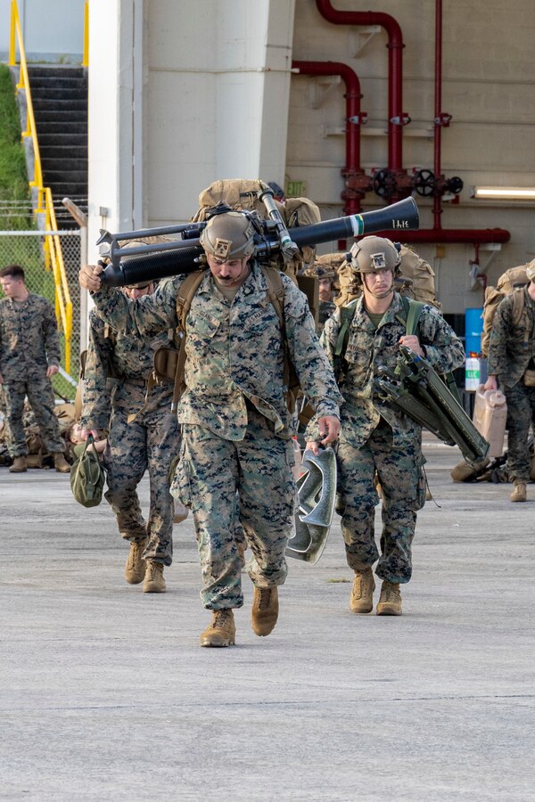 U.S. Marines with Battalion Landing Team 1st Battalion, 7th Marine Regiment, 31st Marine Expeditionary Unit, transport gear during flight operations at Marine Corps Air Station Futenma, Okinawa, Japan, Sept. 26, 2025. The Marines conducted flight operations demonstrating multi-domain transport capabilities of the 31st MEU. The 31st MEU, the Marine Corps’ only continuously forward-deployed MEU, provides a flexible and lethal force, ready to perform a wide range of military operations as the premiere crisis response force in the Indo-Pacific region. (U.S. Marine Corps photo by Lance Cpl. Skilah Sanchez)