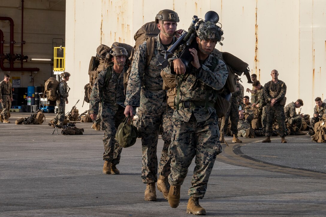U.S. Marines with Battalion Landing Team 1st Battalion, 7th Marine Regiment, 31st Marine Expeditionary Unit, transport gear during flight operations at Marine Corps Air Station Futenma, Okinawa, Japan, Sept. 26, 2025. The Marines conducted flight operations demonstrating multi-domain transport capabilities of the 31st MEU. The 31st MEU, the Marine Corps’ only continuously forward-deployed MEU, provides a flexible and lethal force, ready to perform a wide range of military operations as the premiere crisis response force in the Indo-Pacific region. (U.S. Marine Corps photo by Lance Cpl. Skilah Sanchez)