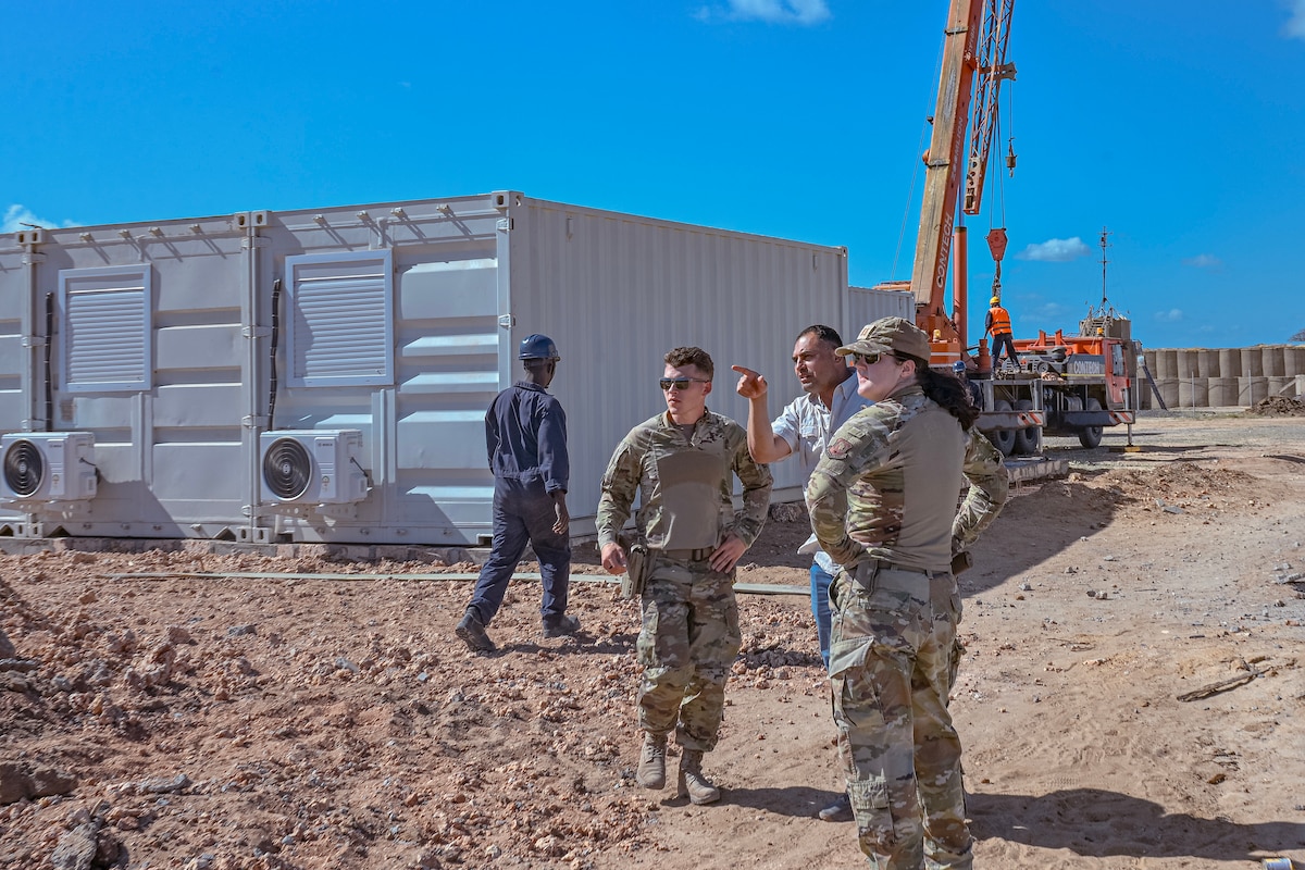 U.S. Air Force Airmen assigned to the 475th Expeditionary Air Base Squadron Civil Engineer and Contracting Flights observe progress on an ongoing construction site at Camp Simba.