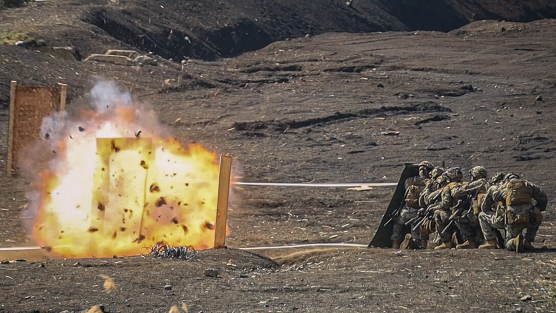 U.S. Marines with Battalion Landing Team 1st Battalion, 7th Marine Regiment, 31st Marine Expeditionary Unit, detonate a detonating cord charge during live-fire training at Combined Arms Training Center, Camp Fuji, Japan, Sept. 29, 2025. Marines conducted combined arms live-fire training to maintain operational readiness, tactical proficiency, and enhance lethality while operating within the first island chain. The 31st MEU, the Marine Corps’ only continuously forward-deployed MEU, provides a flexible and lethal force ready to perform a wide range of military operations as the premiere crisis response force in the Indo-Pacific region. (U.S. Marine Corps photo by Lance Cpl. Victor Gurrola)