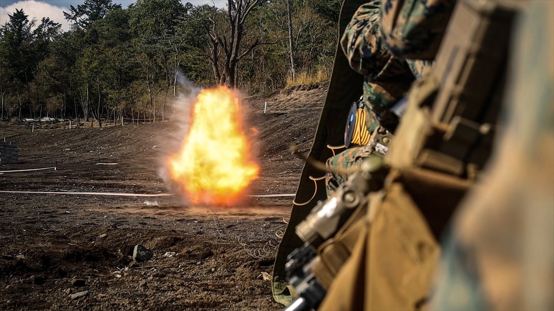 U.S. Marines with Battalion Landing Team 1st Battalion, 7th Marine Regiment, 31st Marine Expeditionary Unit, detonate a detonating cord charge during live-fire training at Combined Arms Training Center, Camp Fuji, Japan, Sept. 29, 2025. Marines conducted combined arms live-fire training to maintain operational readiness, tactical proficiency, and enhance lethality while operating within the first island chain. The 31st MEU, the Marine Corps’ only continuously forward-deployed MEU, provides a flexible and lethal force ready to perform a wide range of military operations as the premiere crisis response force in the Indo-Pacific region. (U.S. Marine Corps photo by Lance Cpl. Victor Gurrola)