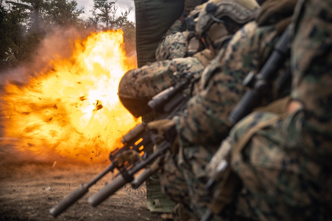 U.S. Marines with Battalion Landing Team 1st Battalion, 7th Marine Regiment, 31st Marine Expeditionary Unit, detonate a detonating cord charge on a simulated door during live-fire training at Combined Arms Training Center, Camp Fuji, Japan, Sept. 29, 2025. Marines conducted combined arms live-fire training to maintain operational readiness, tactical proficiency, and enhance lethality while operating within the first island chain. The 31st MEU, the Marine Corps’ only continuously forward-deployed MEU, provides a flexible and lethal force ready to perform a wide range of military operations as the premiere crisis response force in the Indo-Pacific region. (U.S. Marine Corps photo by Lance Cpl. Victor Gurrola)