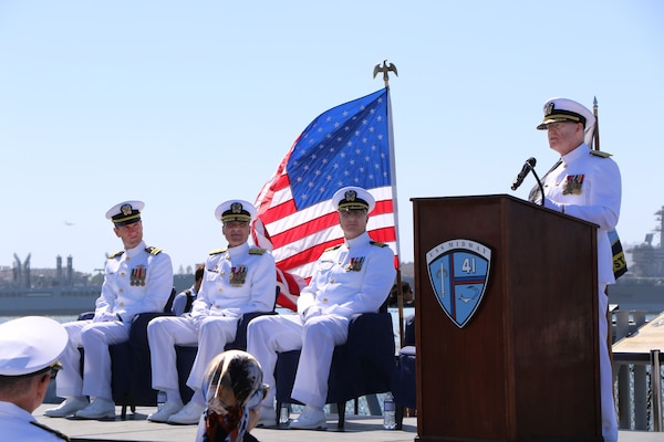 Retired Rear Adm. David Malone delivers the keynote address during Rear Adm. Frank Brajevic’s promotion ceremony aboard the USS Midway on Oct. 4, 2025, highlighting Brajevic's exceptional character and dedication to service. Malone praised Brajevic’s diverse skill set, including his mechanical precision and dental expertise.  (U.S. Navy Photo by Petty Officer 1st Class Nikki Smith)