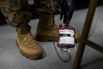 U.S. Navy LT. Soterios Stroud, an emergency medicine specialist with 2nd Medical Battalion, 2nd Marine Logistics Group, practices drawing blood during a tier IV Tactical Casualty Combat Care course at Marine Corps Base Camp Lejeune, North Carolina, Sept. 29, 2025. 2nd MLG became the first-ever Marine Corps command to host a Tier IV TCCC course and is now hosting its second iteration. The course trains select military service members to become proficient combat paramedics capable of providing advanced casualty care at the point of injury on the battlefield and in austere environments. (U.S. Marine Corps photo by Lance Cpl. Isabella Ramos)