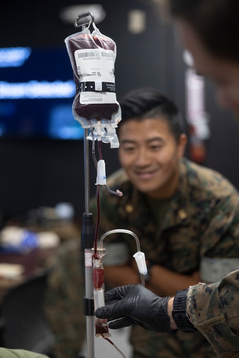 U.S. Navy LT. Antonia De Jesus, a nurse with 2nd Medical Battalion, 2nd Marine Logistics Group, practices drawing blood during a Tier IV Tactical Casualty Combat Care course at Marine Corps Base Camp Lejeune, North Carolina, Sept. 29, 2025. 2nd MLG became the first-ever Marine Corps command to host a Tier IV TCCC course and is now hosting its second iteration. The course trains select military service members to become proficient combat paramedics capable of providing advanced casualty care at the point of injury on the battlefield and in austere environments. (U.S. Marine Corps photo by Lance Cpl. Isabella Ramos)