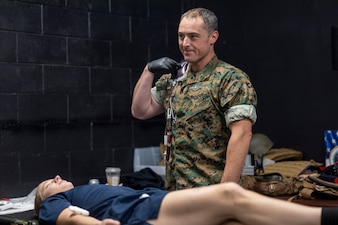 U.S. Navy Lt. j.g. Derrick Reddick, a field medical technician with 2nd Medical Battalion, 2nd Marine Logistics Group, practices blood transfusions during a Tier IV Tactical Casualty Combat Care course at Marine Corps Base Camp Lejeune, North Carolina, Sept. 29, 2025. 2nd MLG became the first-ever Marine Corps command to host a Tier IV TCCC course and is now hosting its second iteration. The course trains select military service members to become proficient combat paramedics capable of providing advanced casualty care at the point of injury on the battlefield and in austere environments. (U.S. Marine Corps photo by Lance Cpl. Isabella Ramos)