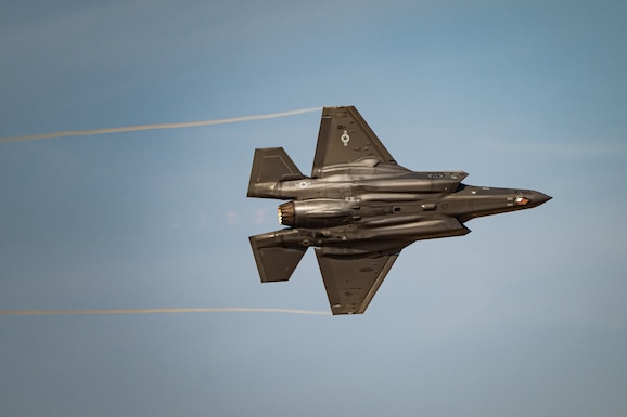 A U.S. Air Force F-35A Lightning II aircraft flown by the F-35 aerial demonstration team assigned to the 388th Fighter Wing at Hill Air Force Base, Utah, performs aerial maneuvers Nov. 15, 2025, over Al Maktoum International Airport in Dubai, United Arab Emirates. The fifth-generation stealth fighter rehearsed its performance prior to the Dubai Airshow 2025. (U.S. Air Force photo by Tech. Sgt. Justin Norton)