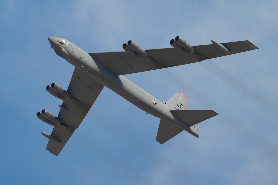 A U.S. Air Force B-52 Stratofortress aircraft, assigned to the 96th Bomb Squadron from Barksdale Air Force Base, Louisiana, flies over spectators at the Dubai Airshow 2025, Nov. 17, 2025, at the Al Maktoum International Airport in Dubai, United Arab Emirates. The B-52 flew from Rota, Spain, to participate in the event, showcasing U.S. airpower on a global stage. (U.S. Air Force photo by Staff Sgt. Tylin Rust)