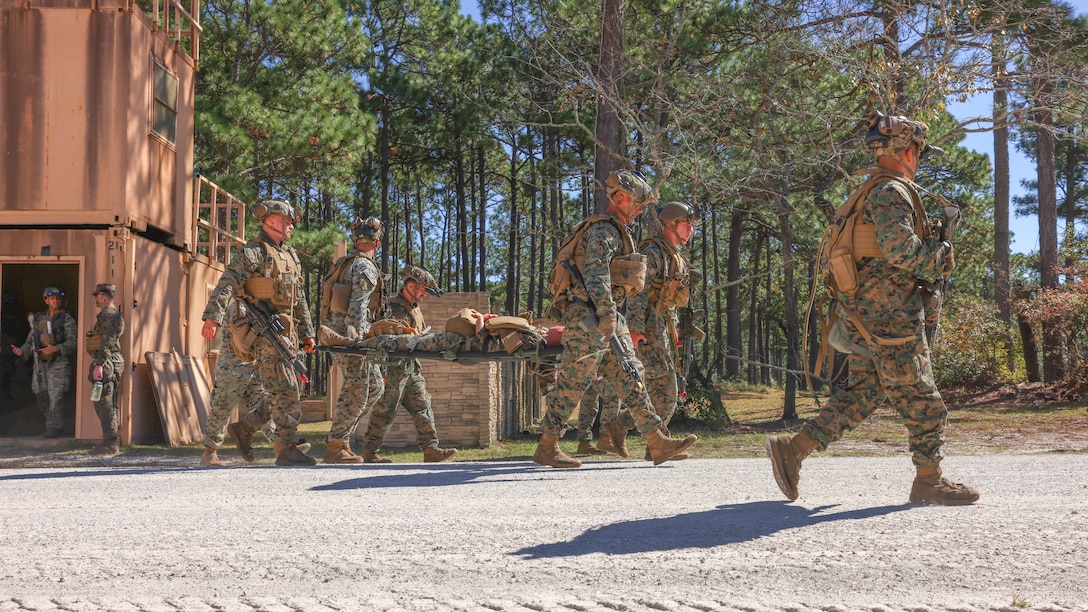 U.S. Marines with 2nd Battalion, 8th Marine Regiment, 2nd Marine Division evacuate a simulated casualty during a Marine Corps Combat Readiness Evaluation on Marine Corps Base Camp Lejeune, North Carolina, Oct. 21, 2025. Marines and Sailors with 2nd Marine Regiment, 2nd MARDIV conducted the MCCRE in order to demonstrate combat proficiency through the combined use of modern infantry tactics and technology, ensuring readiness for any future conflict or operation. (U.S. Marine Corps photo by Lance Cpl. Dominic Trujillo)