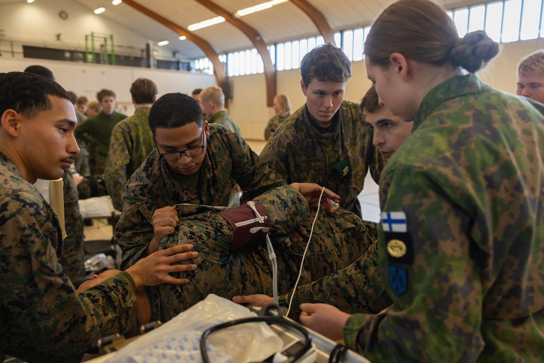 U.S. Navy Sailors with Combat Logistics Battalion 6, Combat Logistics Regiment 2, 2nd Marine Logistics Group, and Finnish navy service members conduct a bilateral medical training exercise as part of Exercise Freezing Winds 2025 in Dragsvik, Finland, Nov. 17, 2025. The training brought medical personnel together to improve lifesaving skills, reinforce communication, and bolster bilateral mission readiness. Freezing Winds is conducted to increase interoperability between Marines, Finland, and NATO Allies by executing combined amphibious operations in and around the Baltic Sea littorals, and is part of a regularly occurring series of exercises in northern Europe that demonstrates the capability to deploy and train Marines and Sailors in support of the NATO Alliance. (U.S. Marine Corps photo by Lance Cpl. Brady V. Hathaway)