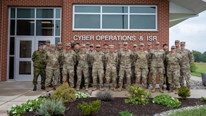 Maryland National Guard cyber operators and members of the Estonian Defence Forces pose for a group photo during Baltic Blitz 25 at Warfield Air National Guard Base at Martin State Airport, September 25, 2025. Members of the Estonian Defence Forces led the exchange by conducting workshops throughout the week focusing on tactics and capabilities related to critical thinking, as well as the collection and management of information. (U.S. Air National Guard Photo by Airman 1st Class Sarah Hoover)