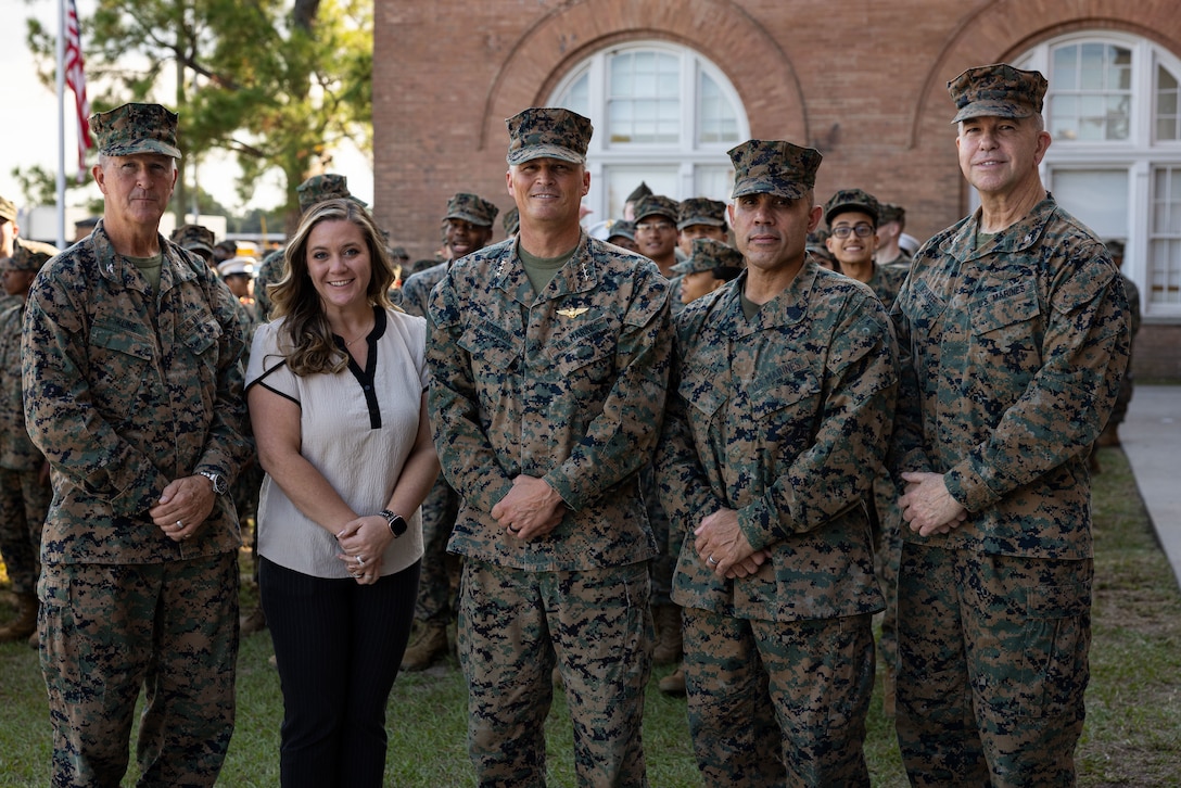 Leaders with Marine Forces Reserve, Marine Forces South and New Orleans Military and Maritime Academy pose for a group photo after a ceremony celebrating the 250th Marine Corps birthday, in New Orleans, Nov. 14, 2025. The ceremony consisted of speeches by guest speakers U.S. Marine Corps Lt. Gen. Leonard F. Anderson IV, commander, Marine Forces Reserve and Marine Forces South, and Sgt. Maj. Edwin A. Mota, command senior enlisted leader, the marching of colors, cake-cutting and the reading of the birthday message. (U.S. Marine Corps photo by Lance Cpl. Juan Diaz)