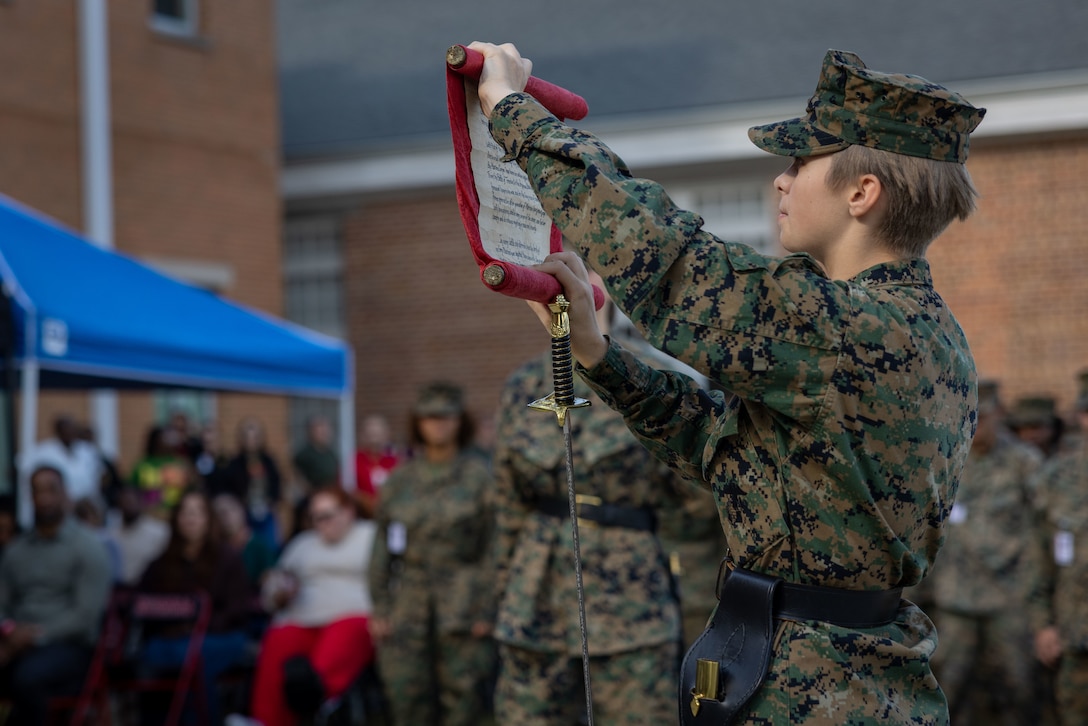 A student with New Orleans Military and Maritime Academy reads a birthday message during a ceremony celebrating the 250th Marine Corps birthday, in New Orleans, Nov. 14, 2025. The ceremony consisted of speeches by guest speakers U.S. Marine Corps Lt. Gen. Leonard F. Anderson IV, commander, Marine Forces Reserve and Marine Forces South, and Sgt. Maj. Edwin A. Mota, command senior enlisted leader, the marching of colors, cake-cutting and the reading of the birthday message. (U.S. Marine Corps photo by Lance Cpl. Juan Diaz)