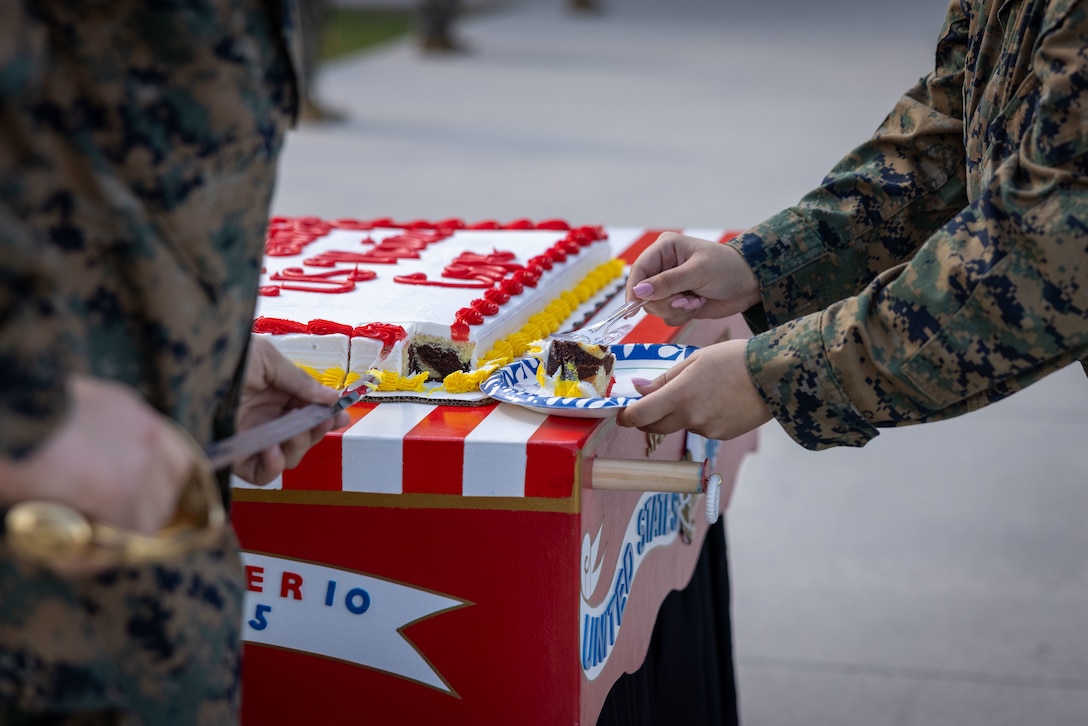 Students with New Orleans Military and Maritime Academy cut a cake during a ceremony celebrating the 250th Marine Corps birthday, in New Orleans, Nov. 14, 2025. The ceremony consisted of speeches by guest speakers U.S. Marine Corps Lt. Gen. Leonard F. Anderson IV, commander, Marine Forces Reserve and Marine Forces South, and Sgt. Maj. Edwin A. Mota, command senior enlisted leader, the marching of colors, cake-cutting and the reading of the birthday message. (U.S. Marine Corps photo by Lance Cpl. Juan Diaz)