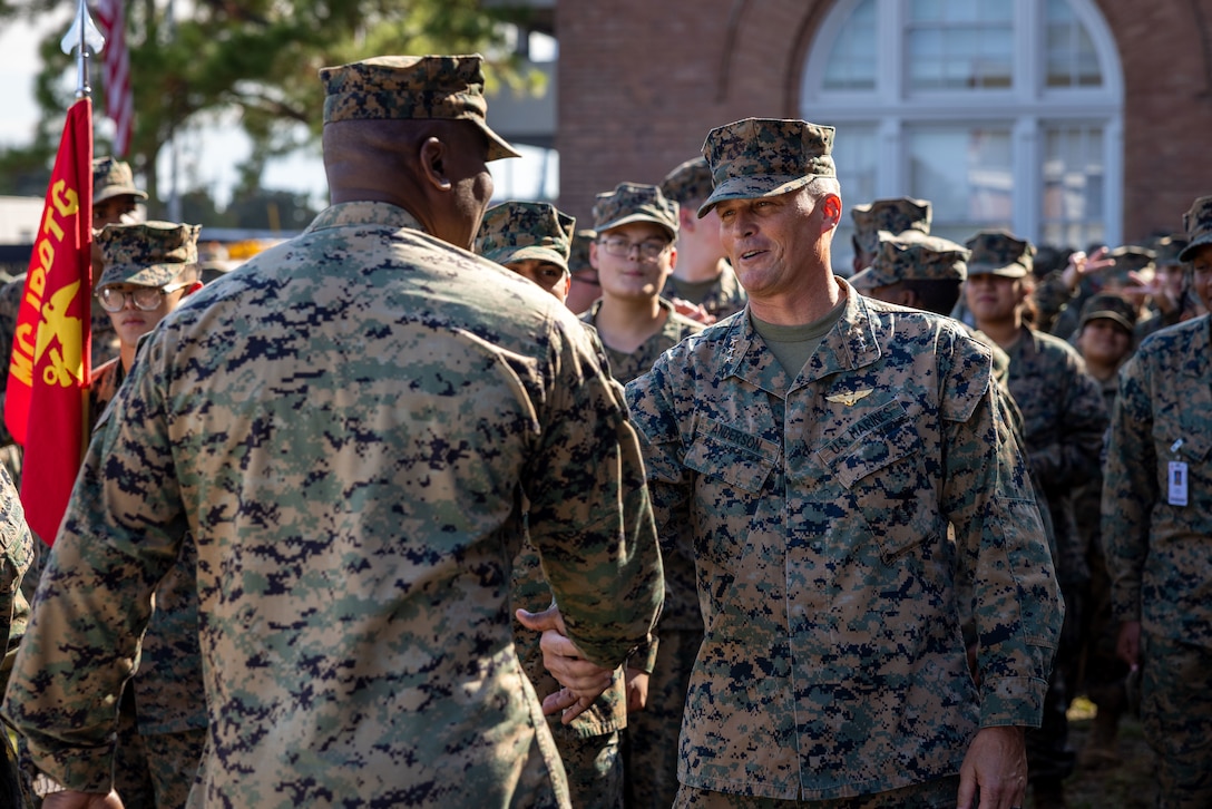 U.S. Marine Corps Lt. Gen. Leonard F. Anderson IV, commander, Marine Forces Reserve and Marine Forces South, greets leaders with New Orleans Military and Maritime Academy after a ceremony celebrating the 250th Marine Corps birthday, in New Orleans, Nov. 14, 2025. The ceremony consisted of speeches by guest speakers U.S. Marine Corps Lt. Gen. Leonard F. Anderson IV, commander, Marine Forces Reserve and Marine Forces South, and Sgt. Maj. Edwin A. Mota, command senior enlisted leader, the marching of colors, cake-cutting and the reading of the birthday message. (U.S. Marine Corps photo by Lance Cpl. Juan Diaz)